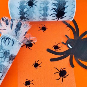 tul estampado con figuras de araña